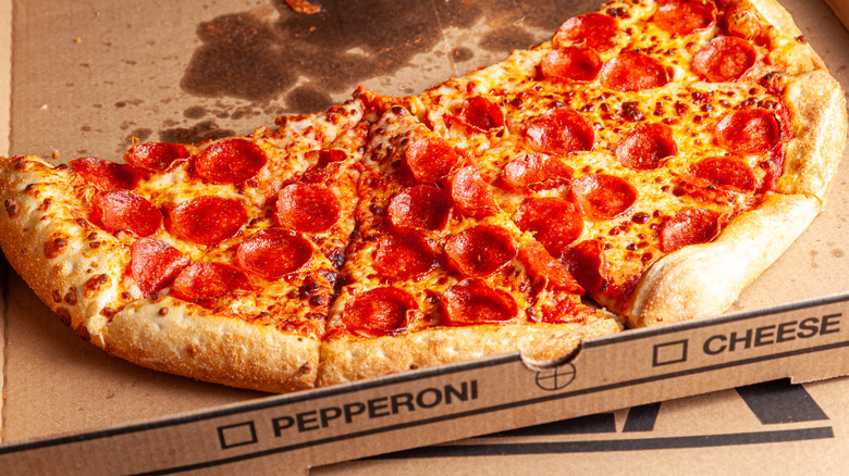 A close-up of peperoni pizza with browned cheese and crust