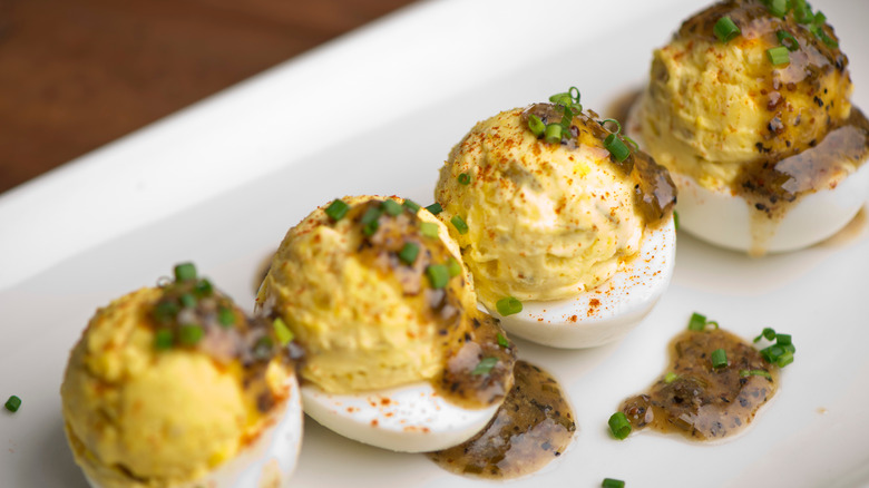 Deviled eggs with an herbal white wine sauce