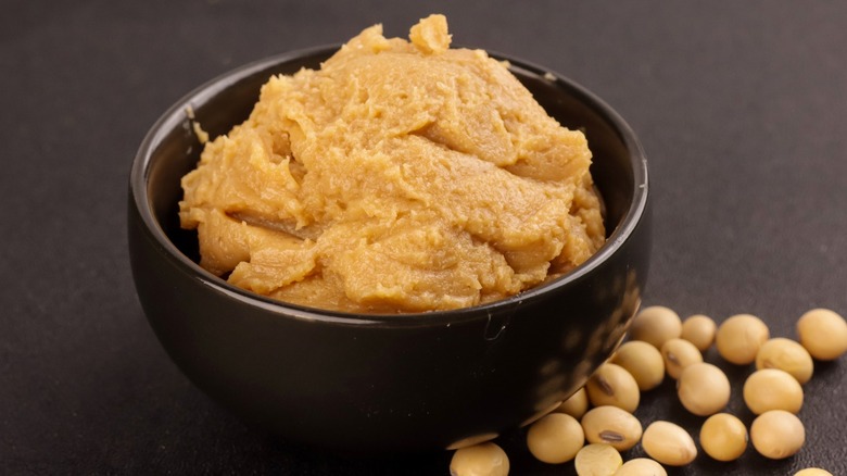 A bowl of miso paste with dried soybeans
