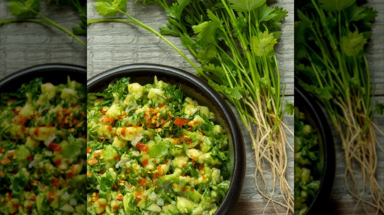 Chunky guacamole with chili flakes in it