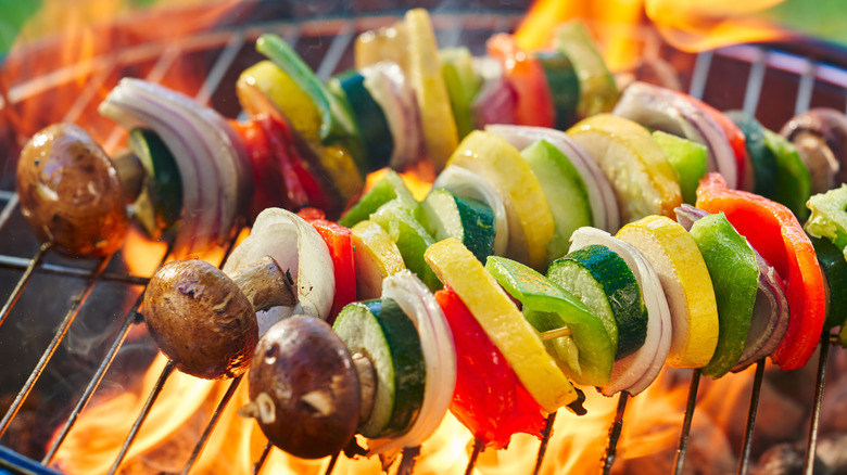 Vegetable kebab skewers with onion, peppers, mushrooms, zucchini, and yellow squash