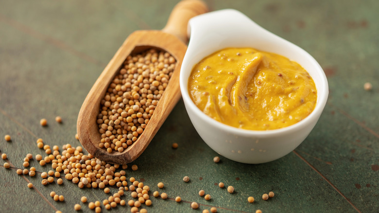 mustard sauce next to whole mustard grains