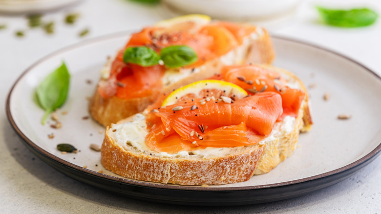 Smoked salmon on toast with herbs and seasonings