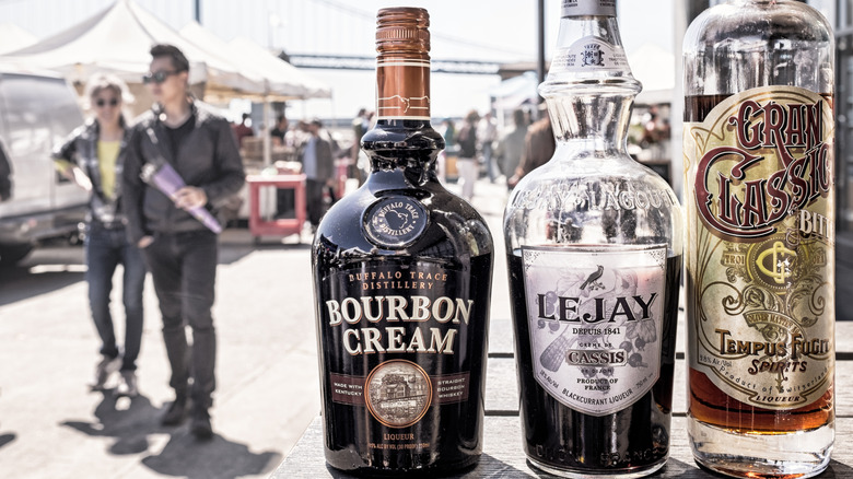 Three bottles of liquor, including Buffalo Trace Bourbon Cream and Lejay