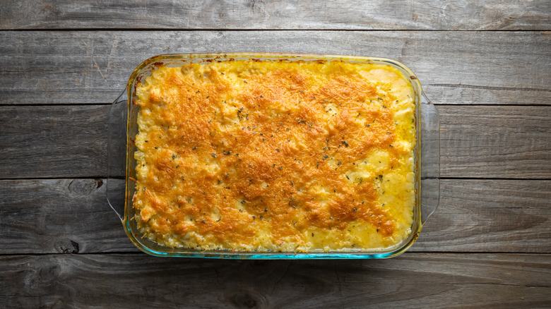 Aerial view of a cheese-topped casserole in a glass baking dish