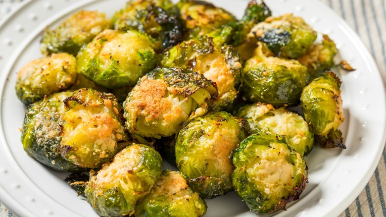 Smashed Brussels sprouts on white plate