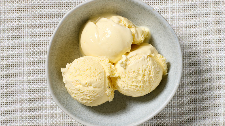 aerial view of three scoops of vanilla ice cream in a bowl