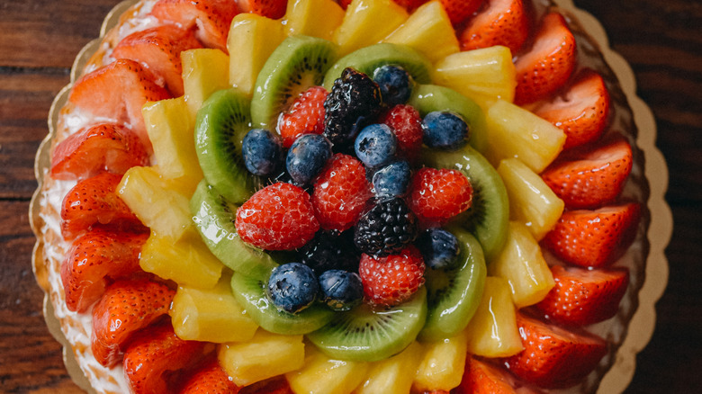 A fruit tart with a shiny glaze coating