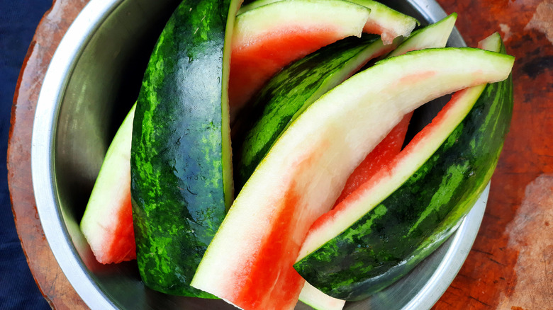 watermelon rinds in a metal bowl