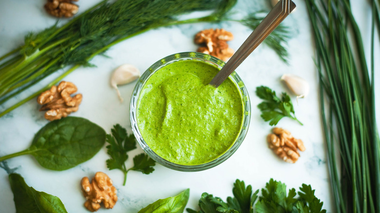green goddess dressing in a bowl with a spoon