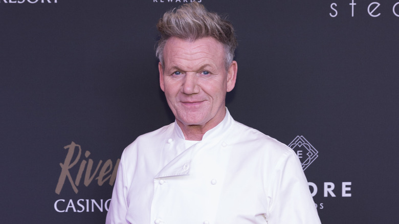 Gordon Ramsay wearing a white chef jacket at an event