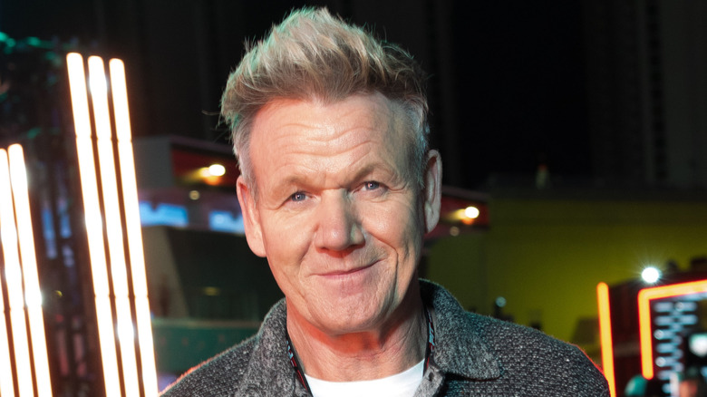 Gordon Ramsay smiles in gray sweater
