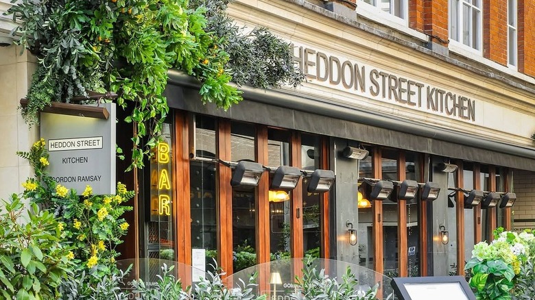 Exterior of Heddon Street Kitchen in brick building with foliage surrounding entrance