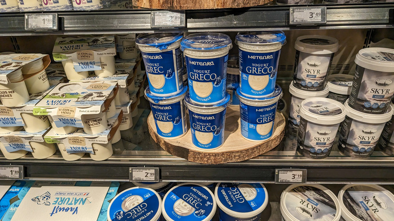 Assortment of yogurts on grocery shelf