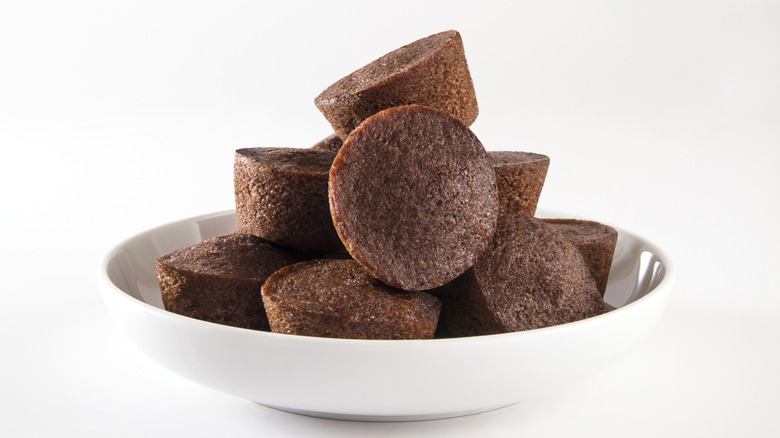 Brownie bites piled on white bowl