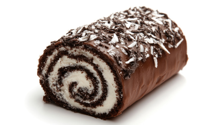 A Chocolate Swiss roll coated with chocolate and sprinkles