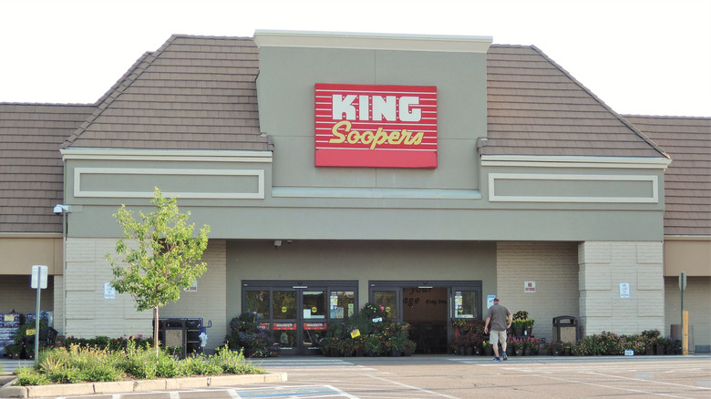 King Soopers storefront with a man entering on a sunny day