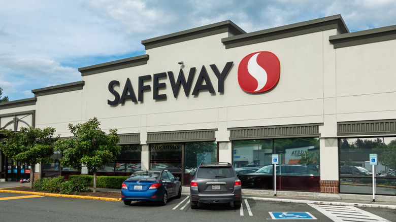 Safeway storefront and parking lot on sunny day