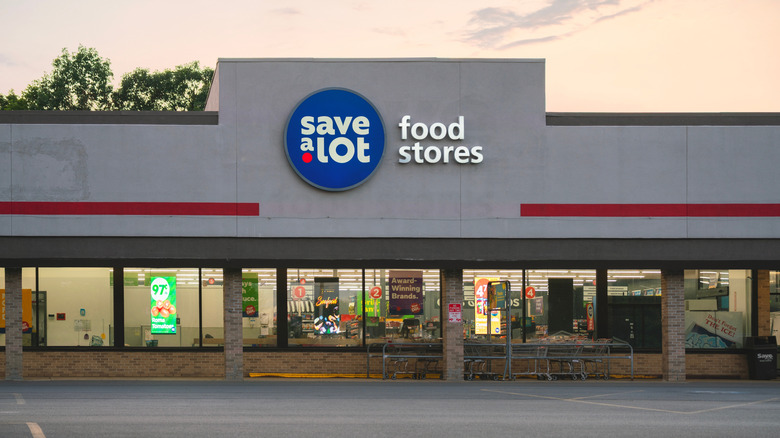 Save-A-Lot storefront and parking lot at dusk