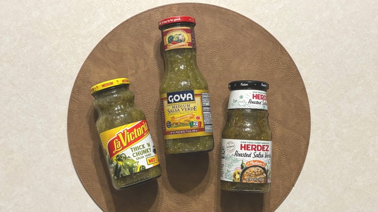 three salsa verde jars on surface