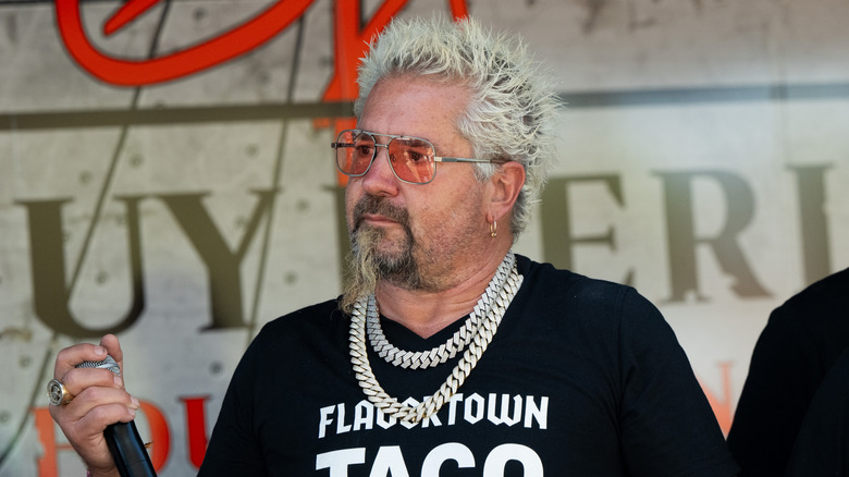 Guy Fieri attends the Guy Fieri Smokehouse day 3 of the Stagecoach Music Festival on April 27, 2025 in Indio, California.