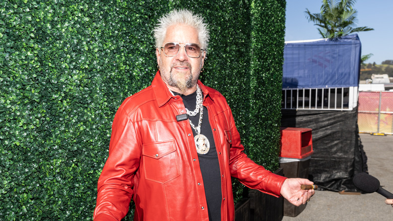 Guy Fieri poses for photos during Guy Fieri's Flavortown Tailgate at Cow Palace Arena & Event Center on February 08, 2026 in Daly City, California.