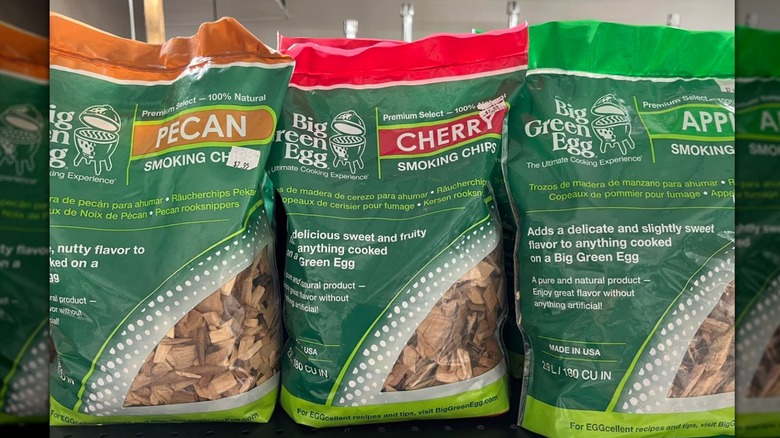 Bags of wood chips lined up on shelf
