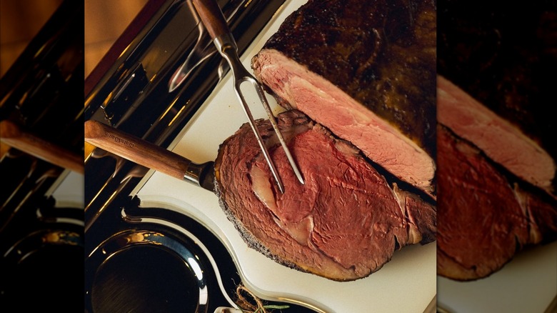 A slice of prime rib is carved from a roast at Arrowhead Grill restaurant