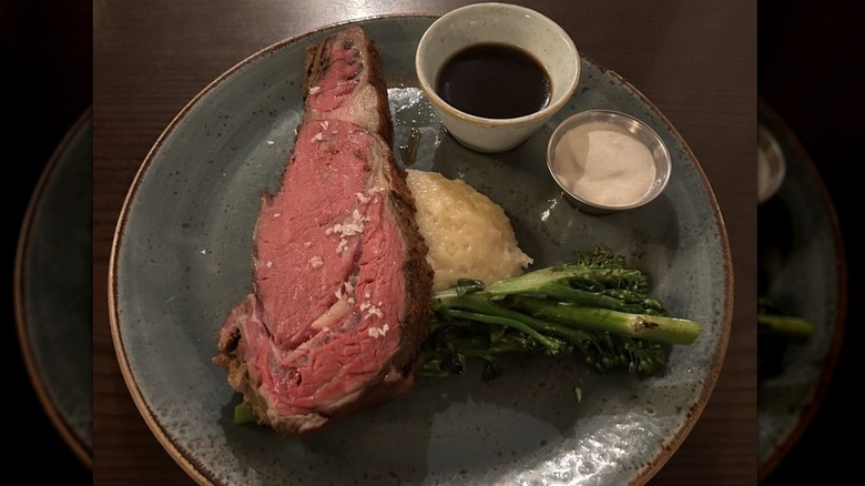 Prime rib served with broccolini, mashed potatoes and two condiments at National Exemplar.