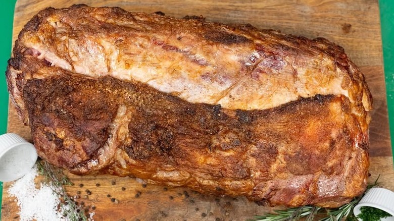 A prime rib roast with savory crust on a cutting board at Southside Steakhouse.