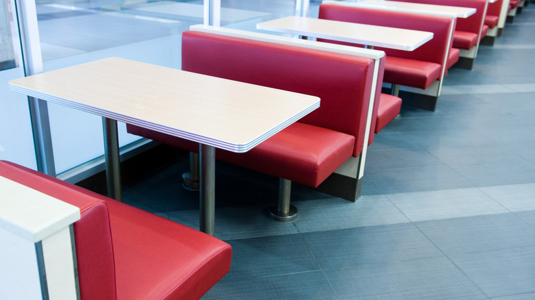 Empty booths inside a fast food restaurant