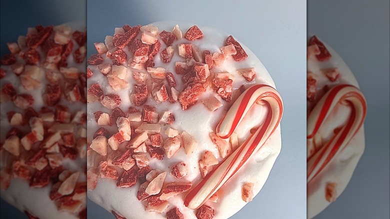 A close-up of a candy cane donut from Boom Coffee