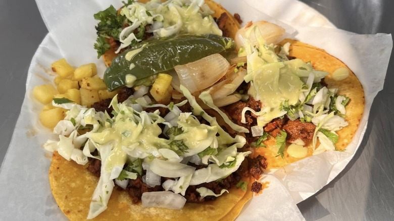 A paper plate of tacos from California Mexican Food