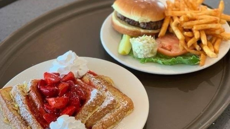 Plates at Tony's Family Restaurant & Breakfast Cafe, featuring a burger and fries, and French toast