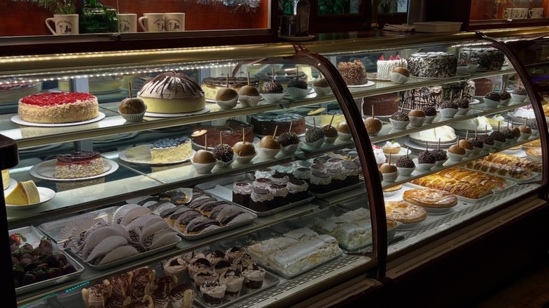 Clinton Station Diner dessert display case filled with various cakes, pies, and sweets