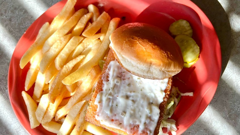 A fish sandwich with fries from Roadhouse Cafe