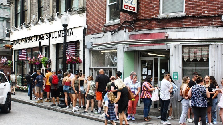 Exterior of Monica's Mercato with a line of customers, Boston