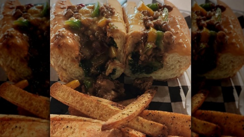 Jerk Cheesesteak with Alkaline Burro Fries from Rooted AF in Wilmington, Delaware