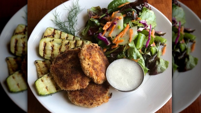 Vegan crab cakes, grilled zucchini, and salad from Trumpet Blossom Cafe in Iowa City, Iowa