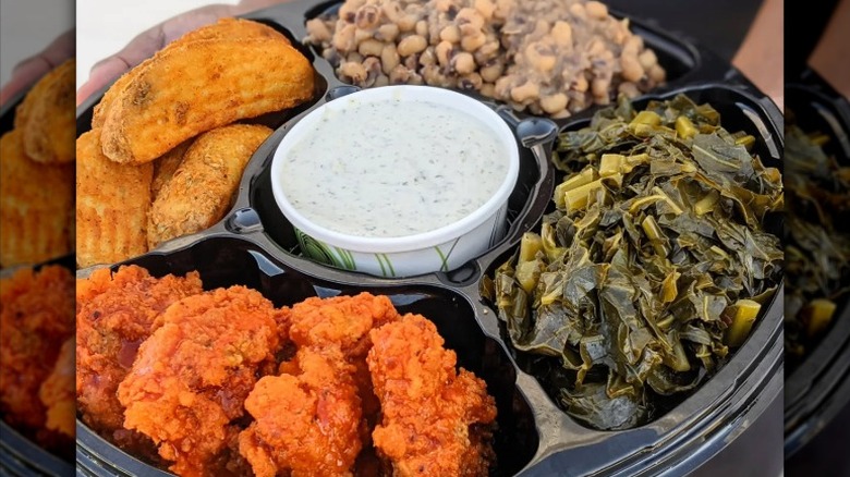 Vegan fried chicken, potato wedges, black eyed peas, and collard greens from A Peace of Soul Vegan Kitchen in Columbia, South Carolina