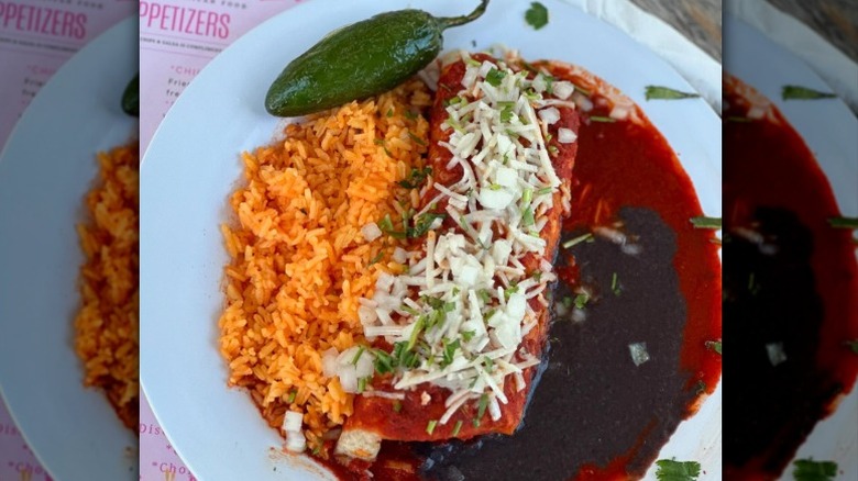 Vegan enchilada with red sauce, rice, and beans from Belenty's Love in Fort Worth, Texas