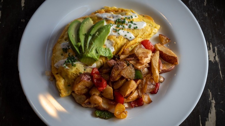 Vegan omelet with avocado, roasted potatoes, and bell peppers from The Wayward Vegan in Seattle, Washington