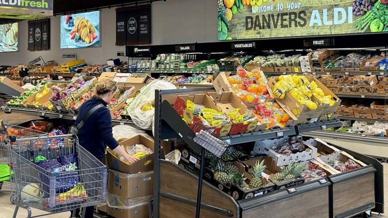 Person shopping in Aldi's produce section