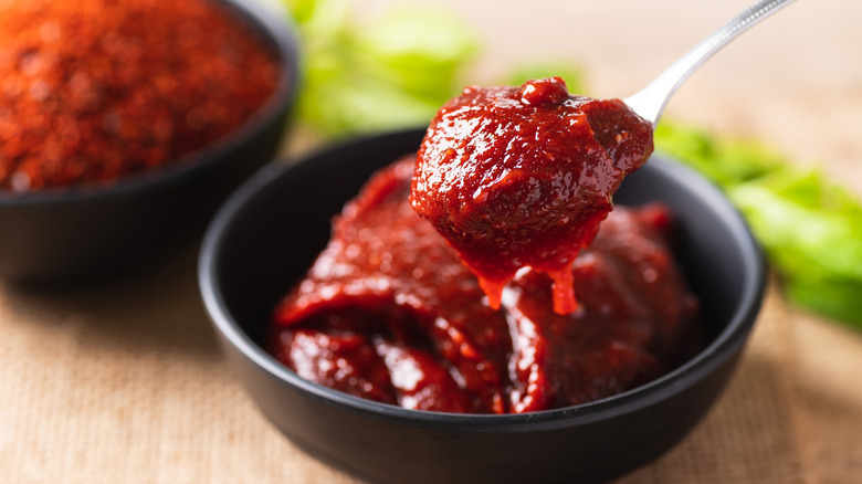 Gochujang in a bowl with a spoon