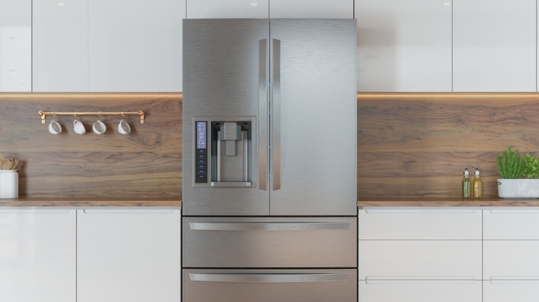 A grey refrigerator in a modern kitchen.