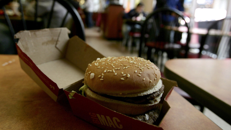 A whole Big Mac in its opened box at a McDonald's location in the 2000s