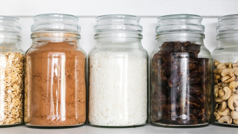 Pantry jars containing several dried goods.