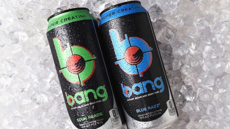 Two cans of Bang energy drink on a bed of ice