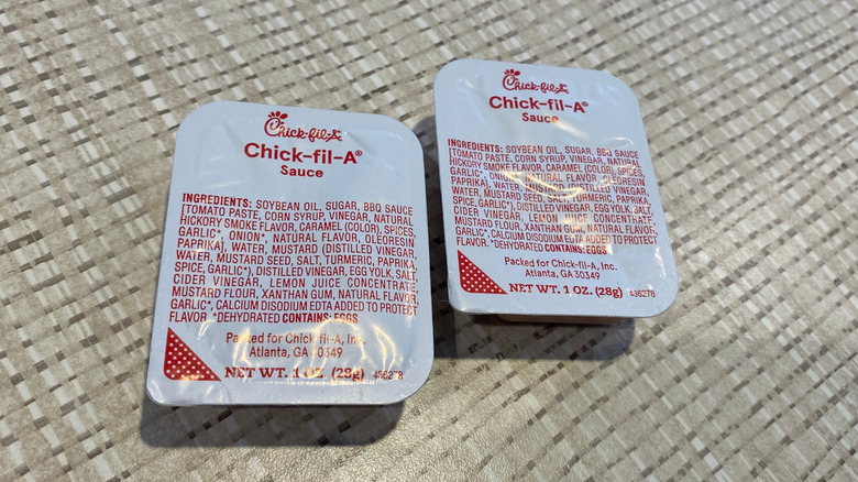Two individual packets of Chick-fil-A sauce