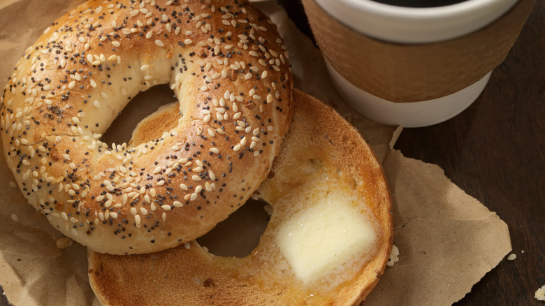 Buttered bagel with coffee